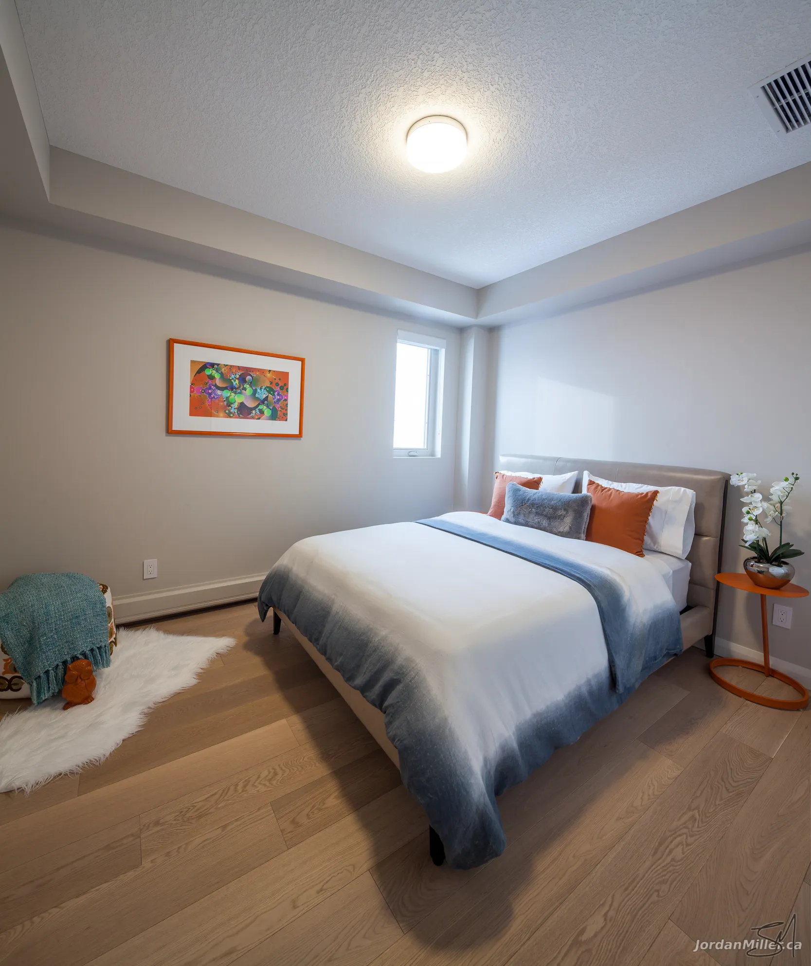 Guest bedroom with large windows